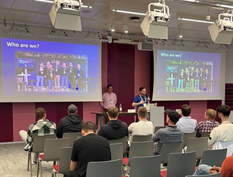 A session in progress at Workplace Ninjas Germany, with two presenters at the front of a full room.